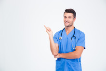 Portrait Of A Male Doctor Pointing Finger Away