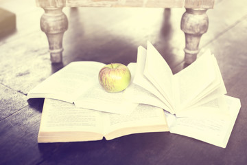 Poster - some books and an apple on the floor