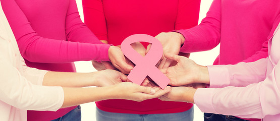 Wall Mural - close up of women with cancer awareness ribbons