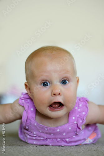 baby girl making funny face buy this stock photo and explore