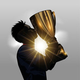 Fototapeta Sport - Soccer player kissing trophy