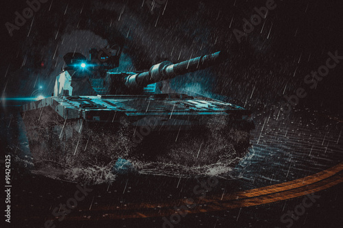 Fotografie, Tablou The modern battle tank moving at night in the rain on a mission