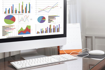 Poster - Computer showing analysis chart and graph in office
