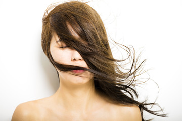 young Woman  with hair motion on white background