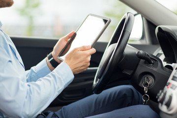 Sticker - close up of young man with tablet pc driving car