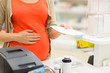 © Syda Productions - pregnant woman buying medication at pharmacy