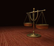 Gold Scales of Justice on wood table