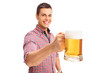 © Ljupco Smokovski - Joyful man holding a large beer mug