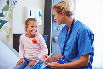 Wall Mural - Girl Talking to Nurse In Hospital Room