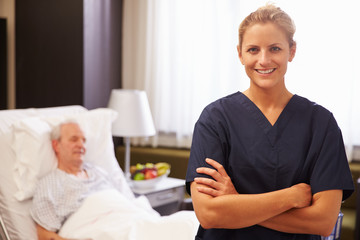 Wall Mural - Portrait Of Nurse With Senior Male Patient In Hospital Bed