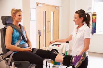 Wall Mural - Female Patient Working With Physiotherapist In Hospital