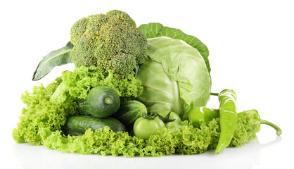 Fototapete - Heap of green vegetables isolated on white