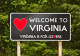 Fototapeta Sawanna - Virginia is for Lovers, state moto and welcome sign on a billboard sorrounded by trees