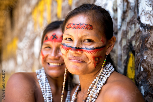 Fotografie, Tablou Native Brazilian women smiling at an indigenous tribe in the Amazon