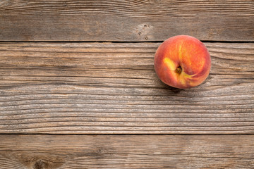 Wall Mural - peach fruit on weathered wood