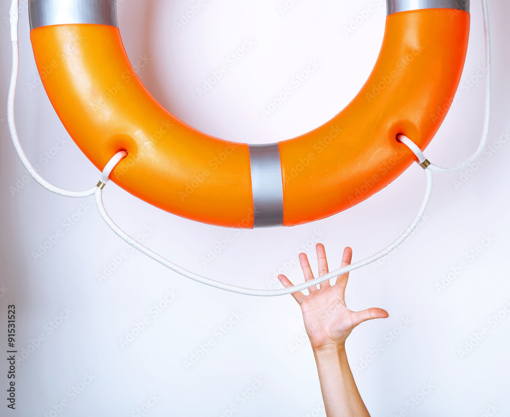 Human hand reaching for life preserver, isolated on white