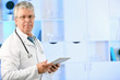 © Africa Studio - Doctor with digital tablet at his workplace