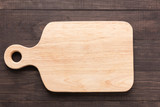 Fototapeta Góry - Cutting board on the wooden background. Top view
