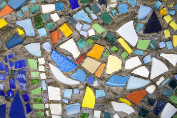 Mosaic on the wall. Mosaic of colored glass. Art and creativity. Fantasy and abstraction. The background and texture.