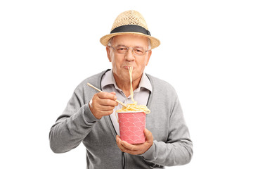 Poster - Senior eating Chinese noodles from a paper box