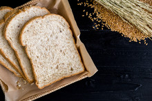 Whole Wheat Bread Background / Whole Wheat Bread / Whole Wheat Bread On Black Wooden Background