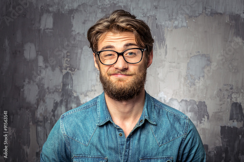 Fotografia, Obraz Bearded man with an expression of discontent on his face