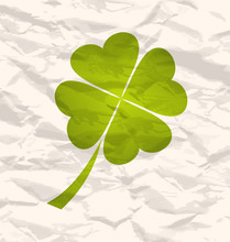 Clover With Four Leaves On Crumpled Paper