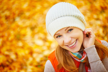 Poster - face of happy girl with autumn leaves on walk