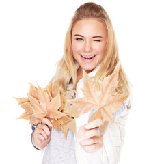 Wall Mural - Joyful girl with dry leaves