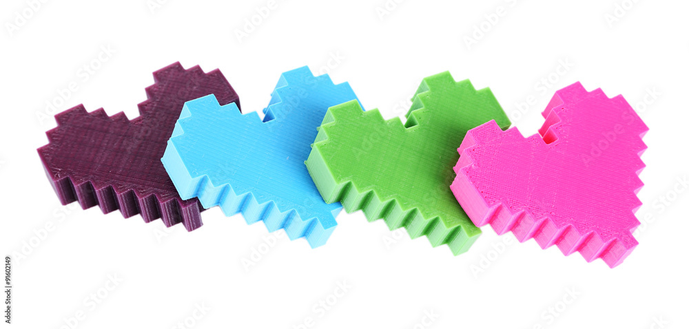 Plastic puzzle hearts isolated on white