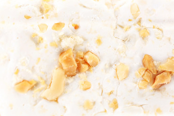 Wall Mural - Sweet nougat with hazelnuts close up
