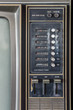 Control panel of old classic color analog television. It has channel selector dials, push power switch and set of volume, color, contrast, brightness adjustment control.