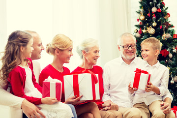 Canvas Print - smiling family with gifts at home