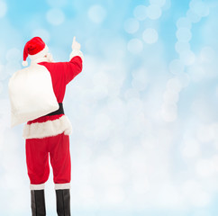 Wall Mural - man in costume of santa claus with bag