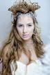beauty young snow queen in fairy flashes with hair crown on her