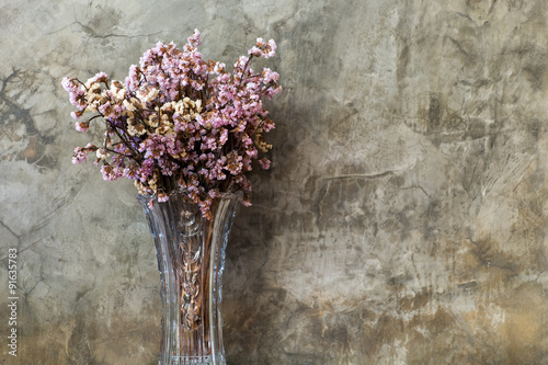 Dry flower in tall and transparent vase