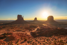 Dawn Sunshine Over The Monument Valley, Desert Canyon In USA