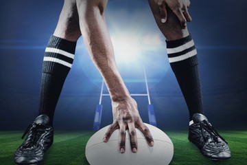 Poster - Composite image of low section of athlete playing rugby