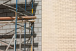 © Jacques Durocher - Description:scaffold construction gray bricks wall background
