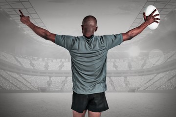 Poster - Composite image of rear view of athlete with arms raised