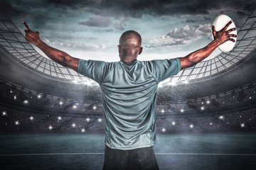 Poster - Composite image of rear view of athlete with arms raised