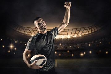 Wall Mural - Composite image of happy rugby player punching the air