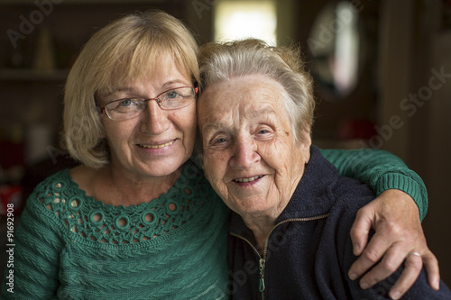 Fotografie, Obraz Portrait of an adult woman with his elderly mother.