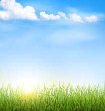 Green Grass Lawn With Clouds And Sun On Blue Sky