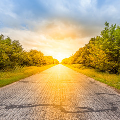 Empty asphalt road at sunset