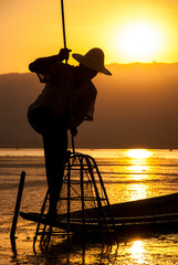 Wall Mural - Silhouette fisherman at Inle Lake, Myanmar