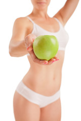 Wall Mural - Athletic girl with green apple.