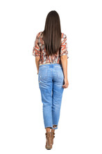 Rear View Of Woman With Long Hair In Casual Clothes Walking Away
