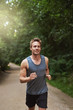 © Flamingo Images - Athletic Man Running at the Park in the Morning