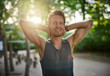© Flamingo Images - Fit Man at the Park with Hands Behind his Head